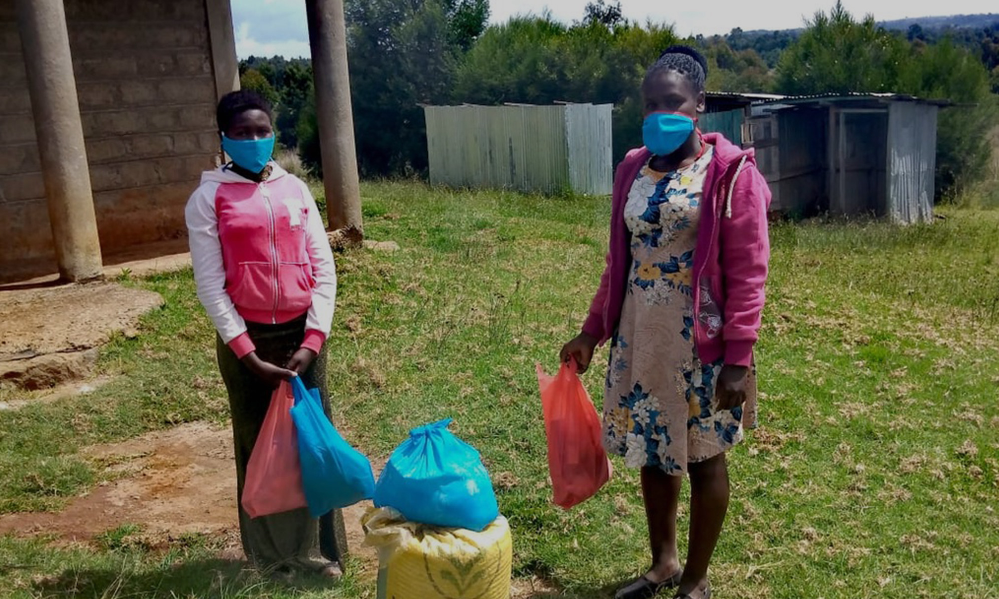 two girls receive relief packages