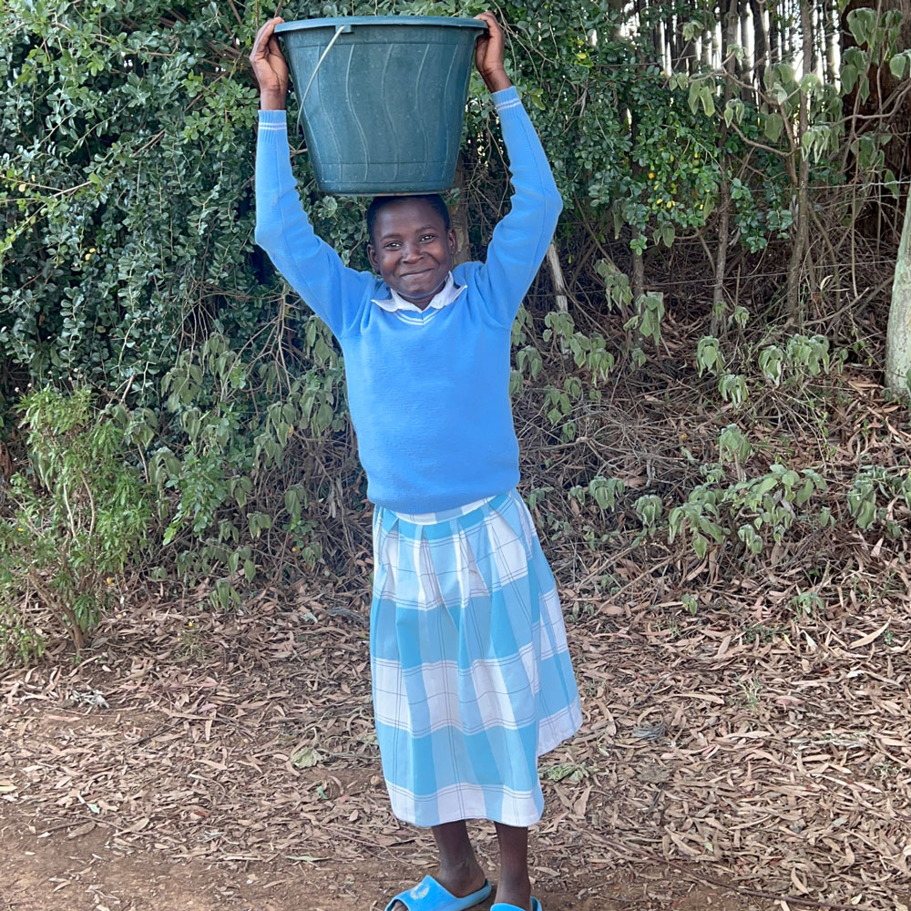 girl carrying water kenya